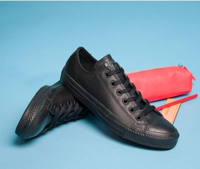 All black converse with a rubber sole.
